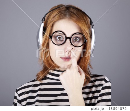 Funny girl with headphone and glasses. Funny girl with headphone and glasses. 13894072