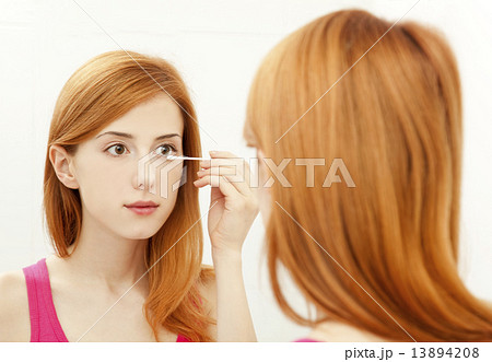 Beautiful redhead young woman with fresh skin of face in bathroo Beautiful redhead young woman with fresh skin of face in bathroo 13894208