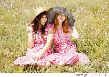 Two girls at contryside. 13894281