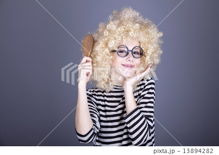 Surprised girl with comb. 13894282