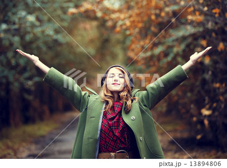 Style redhead girl at beautiful autumn alley. 13894806