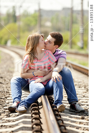 Couple kissing at railway. Couple kissing at railway. 13895188