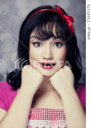 Surprised brunette housewife 13895378