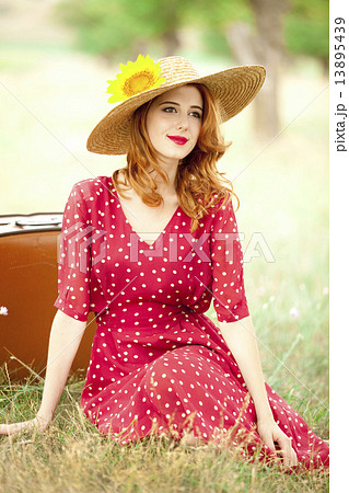 Redhead girl with sunflower at outdoor. Redhead girl with sunflower at outdoor. 13895439