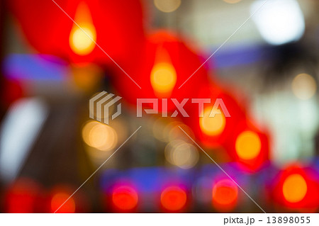 Blurry and Bokeh Background consisting red lanterns and lights Blurry and Bokeh Background consisting red lanterns and lights 13898055