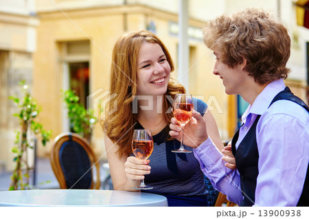 Beautiful couple drinking rose wine 13900938