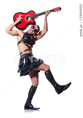 Man in woman clothing with guitar 13904093