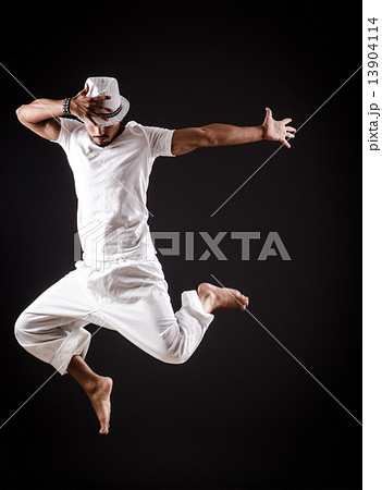 Dancer dancing dances in white clothing Dancer dancing dances in white clothing 13904114