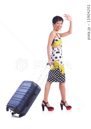 Young woman preparing for vacation 13904201