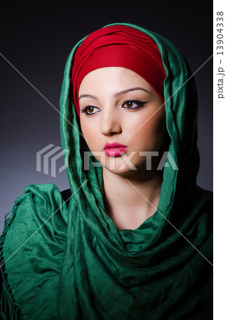 Muslim woman with headscarf in fashion concept 13904338