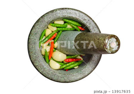 Garlic,Red and Green Chilli in stone mortar and pestle - isolate Garlic,Red and Green Chilli in stone mortar and pestle - isolate 13917635