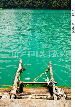 Ladder made of wood into the water 13918830