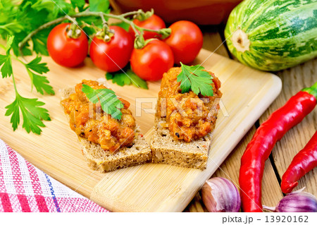 Sandwich with caviar squash and red pepper on board Sandwich with caviar squash and red pepper on board 13920162
