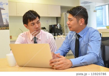 Asian business men discussing project on Laptop Asian business men discussing project on Laptop 13920786