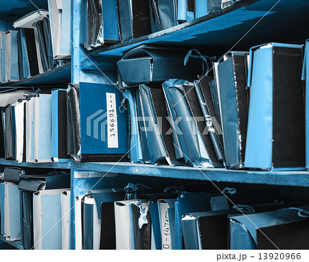 Paper documents stacked in archive 13920966