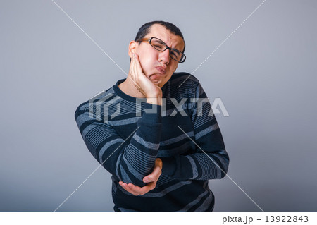 male of European appearance brunet in a striped sweater put his  13922843