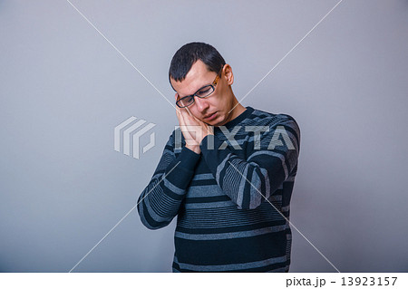 male of European appearance brunet sleeping hands behind head on 13923157