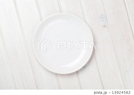 Empty plate over white wooden table 13924562