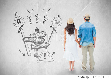 Composite image of happy hipster couple holding hands 13928169