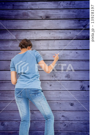 Composite image of pretty brunette playing air guitar Composite image of pretty brunette playing air guitar 13928197