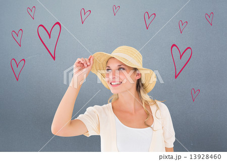 Composite image of attractive young blonde smiling in sunhat 13928460