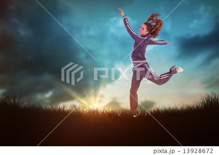 Composite image of full length side view of a sporty young blond 13928672