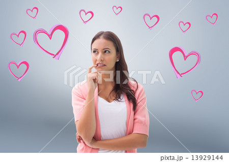 Composite image of pretty brunette thinking with finger to mouth 13929144