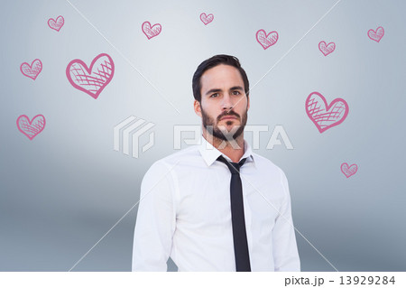 Composite image of unsmiling businessman standing with hands in 13929284