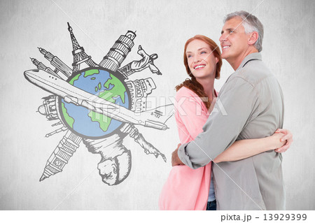 Composite image of casual couple hugging and smiling 13929399