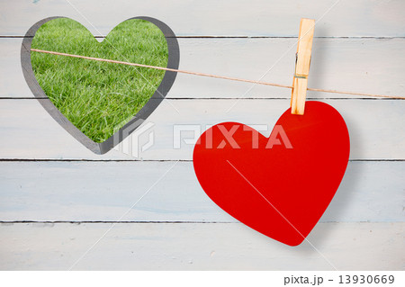 Composite image of heart hanging on line Composite image of heart hanging on line 13930669