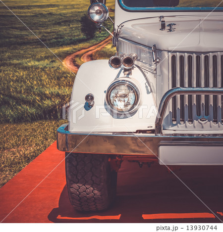 Old retro or vintage car front side. Vintage effect processing Old retro or vintage car front side. Vintage effect processing 13930744