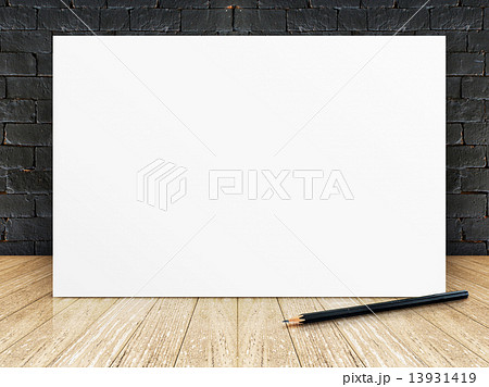 Poster frame at black brick wall and wooden floor 13931419