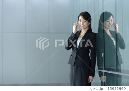 One young successful Chinese businesswoman making mobile call 13933969