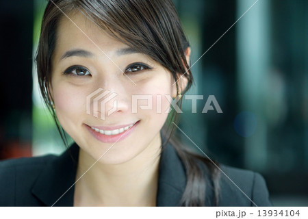 Portrait of one young successful Chinese businesswoman  13934104