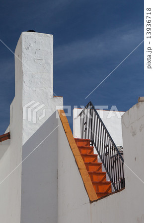 Detail of white house under blue sky 13936718