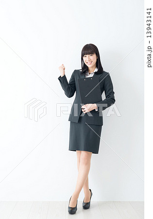 30代 女性 スーツ ガッツポーズの写真素材
