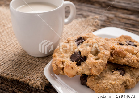 Stack of Chocolate chip cookie and glass of milk Stack of Chocolate chip cookie and glass of milk 13944673