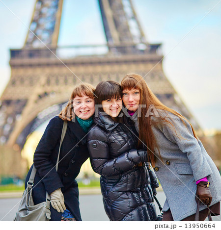 Three girls near the Eiffel tower Three girls near the Eiffel tower 13950664