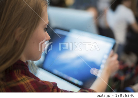 Computer Repair Shop. A woman using a laptop.  13956346