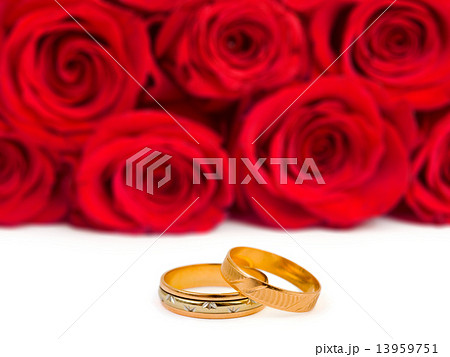 Wedding rings and roses 13959751