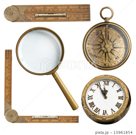 Vintage accessories set. Clock, magnifying glass, compass and ruler isolated 13961854