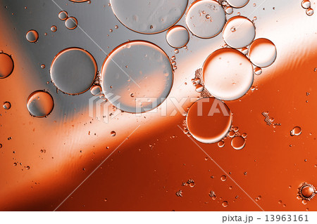 Oil drops on a water surface 13963161