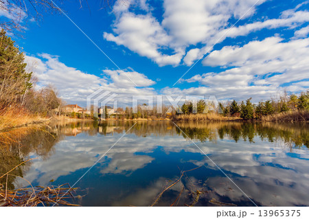 Pond and cloudy sky 13965375