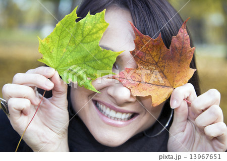 Pretty smile and colorful leaves 13967651