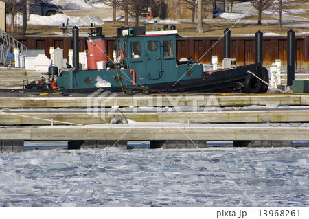 Forgotten boat in the marina 13968261