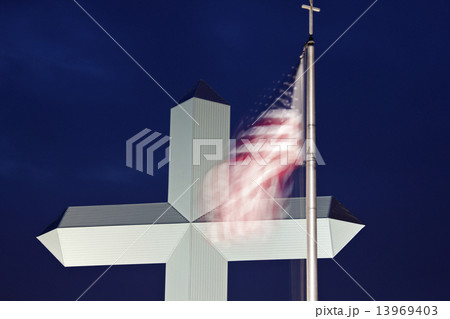 Cross in Effingham with an American flag Cross in Effingham with an American flag 13969403