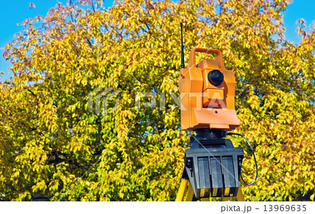 Surveying during colorful fall Surveying during colorful fall 13969635