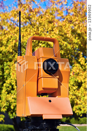 Surveying during colorful fall 13969902