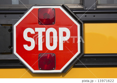 Stop sign on yellow school bus 13971622