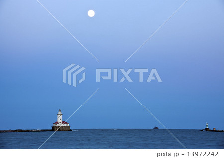 Full Moon rising above Lake Michigan and Chicago Lighthouse 13972242